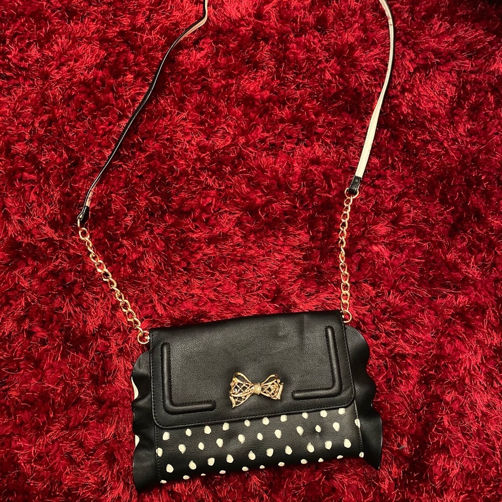 Black polka dot ruffle purse